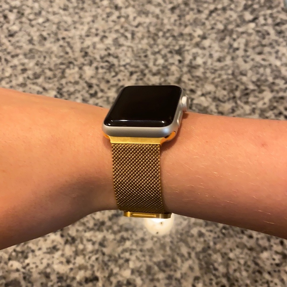 Gold mesh Apple Watch band with matching case